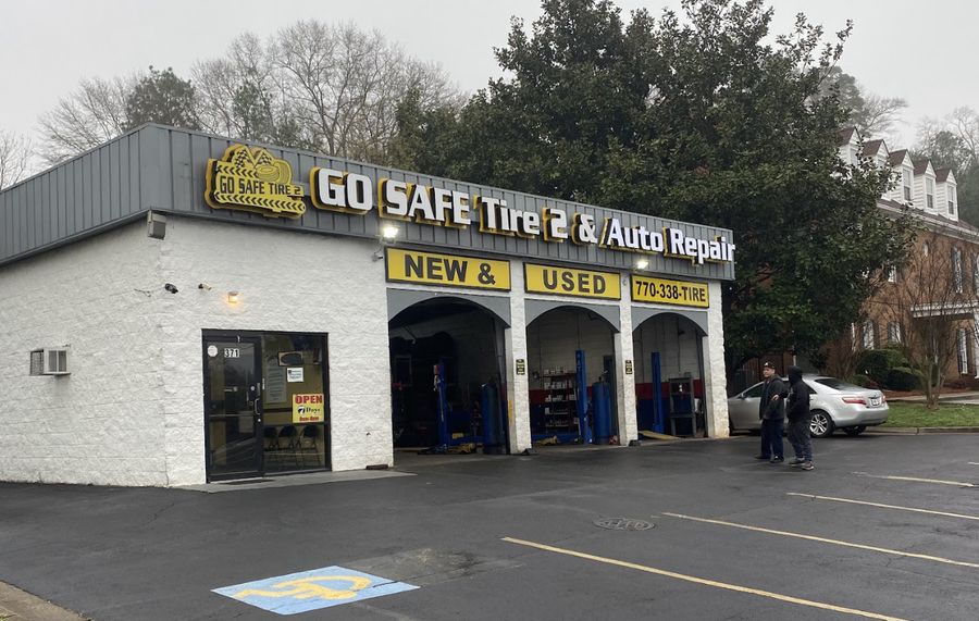 Go Safe Tire 2 storefront entrance and service bays on W Pike St in Lawrenceville, GA