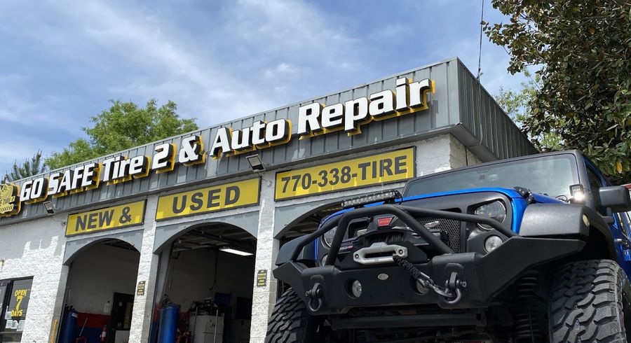 Go Safe Tire 2 shop exterior with service bays and signage on W Pike Street